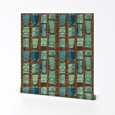 a brown and blue wall hanging on the side of a wall