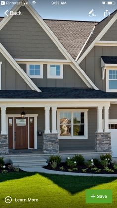 a house with gray siding and white trim