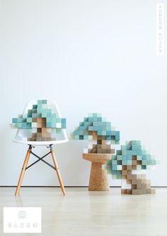 an image of a chair and table made out of blocks on the floor in front of a white wall