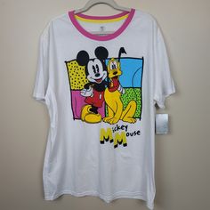 This T-Shirt Features A Playful Design Of Disney's Iconic Characters, Mickey Mouse And Pluto. The Shirt Is Made From Soft, Breathable Cotton And Has A Comfortable, Relaxed Fit. The Vibrant Graphic Of Mickey Mouse And Pluto Will Bring A Touch Of Nostalgia And Whimsy To Any Outfit. Perfect For Any Disney Fan Or Anyone Looking To Add Some Fun To Their Wardrobe. Nwt Disney Mickey Mouse/Pluto White T-Shirt Size 2x Length 32in Armpit To Armpit 25in Page 331 White Mickey Mouse T-shirt For Streetwear, White Mickey Mouse Crew Neck T-shirt, Disney White Pre-shrunk T-shirt, White Pre-shrunk Disney T-shirt, White Pre-shrunk T-shirt For Disney Fan Events, White Crew Neck T-shirt With Mickey Mouse, Disney Fan Merchandise White Tops, White Mickey Mouse Top For Fans, Multicolor Cotton Mickey Mouse T-shirt