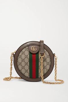 Gucci's latest iteration of its coveted 'Ophidia' bag mirrors the same iconic house codes as the tote version but comes in a modern circular silhouette. Crafted from textured-leather and printed coated-canvas, this mini style is detailed with the brand's iconic heritage webbing and polished 'GG' hardware. The compact interior offers the perfect amount of space to store your phone, cardholder and keys. Gucci Bag Outfit, Gucci Handbags Outlet, Gucci Crossbody Bag, Bags Gucci, Gucci Ophidia, Gucci Crossbody, Vanity Bag, Stylish Handbags, Handbag Heaven