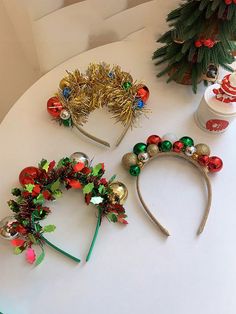 three christmas headbands are sitting on a table