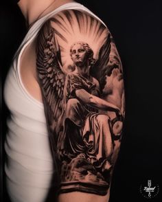 a woman with an angel tattoo on her arm