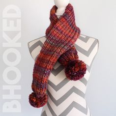 a knitted scarf on top of a mannequin