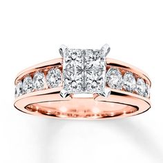 a rose gold engagement ring with two princess cut diamonds