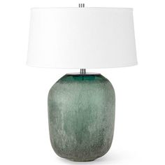 a green table lamp with a white shade on it