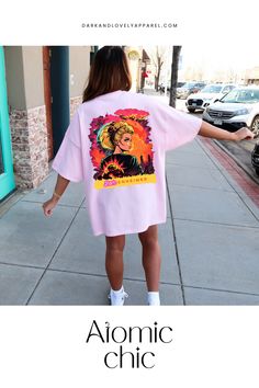 Get ready to turn heads with this Barbie-Inspired T-shirt! A fun and fresh take on the iconic Barbie aesthetic, this oversized t-shirt is perfect for anyone looking to make a statement. Rock it solo or pair it with your favorite denim for an unforgettable spring look.