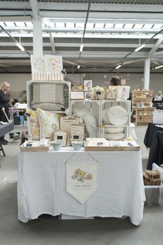 the table is covered with many items for sale