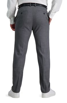 This flat front twill slim- fit pant features a hook and bar closure, and fly front. The off seam pocket design and single welt button through back pockets is what gives this pant a sophisticated look. Crafted in a polyester blend. The elastine fibers allow for the perfect amount of stretch allowing your pant to look its best all day. 32" inseam; 14" leg opening (size 30x32) Zipper fly with hook and bar closure Belt loops Dual pockets Slim fit Solid Twill construction 64% polyester, 34% viscose Slim Fit Elastane Dress Pants For Semi-formal Occasions, Semi-formal Slim Fit Elastane Dress Pants, Business Stretch Solid Dress Pants, Business Stretch Dress Pants, Stretch Solid Color Dress Pants For Business, Stretch Solid Dress Pants For Business, Elastane Dress Pants For Business Casual, Solid Color Slim Fit Dress Pants For Business, Slim Fit Solid Dress Pants For Business