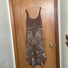 Miss Me Paisley High Low Dress With Adjustable Straps In Size Small. Lined. Approximate Length In Front Is 33 1/2 Inches And Back Is Approximately 41 Inches. Pit To Pit Approximately 14 Inches And Width At The Narrowest Is Approximately 13 1/2 Inches. Comes From A Smoke Free Home. Brown Boho Print Sleeveless Dress, Paisley Dress Brown, Brown Paisley Print Summer Dress, Spaghetti Strap Summer Dress, V-neck Paisley Print Beach Sundress, Flowy Floral Dress, Patterned Paisley Print V-neck Dresses, Country Dresses, Tent Dress