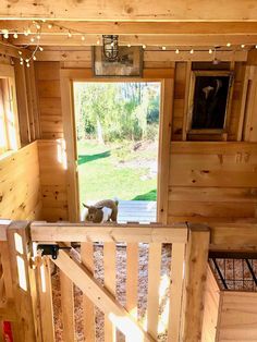 the inside of a small cabin with wooden walls