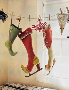 christmas stockings hanging from clothes line in bedroom