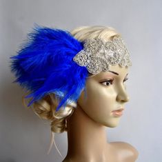 Crystal Applique Headband with Royal Blue feathersReady to shipBeautiful Vintage Style flapper headband.Perfect for a vintage inspired bride, 1920's wedding or  Great Gatsby party or any special occasions.All rhinestone headband. Glamour and stylish Made of : - delicate yet stunning high sparkle rhinestones beaded applique headband - clear and silver beading, rhinestones, crystals  - set of Royal Blue feathers- satin ribbon Headband can be put down on the forehead or up on head. Can be worn as a Vintage Blue Fascinator For Weddings, Adjustable Art Deco Wedding Headpieces, Crystal Headband Wedding, 1920's Wedding, Gatsby Headband, 1920s Headpiece, Headband Crystal, Flapper Headband, Blue Feathers