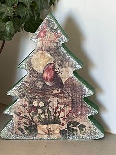 a small christmas tree with a bird on it