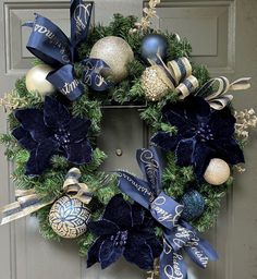 a christmas wreath with blue and gold decorations