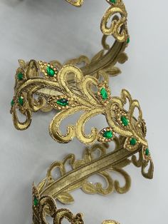 Embellished embroidery ribbon Gold with gold and green gems Center wired Farrisilk 3" x 5 yard roll Elegant Embellished Embroidered Fabric For Celebration, Elegant Party Embroidered Fabric With Machine Embroidery, Elegant Machine Embroidered Fabric For Festive Occasions, Gold Festive Embroidered Fabric, Gold Embroidered Fabric For Festive Occasions, Elegant Green Embroidered Fabric With Intricate Embroidery, Gold Embroidered Fabric For Formal Occasions, Elegant Green Fabric With Intricate Embroidery, Elegant Green Intricate Embroidery Fabric