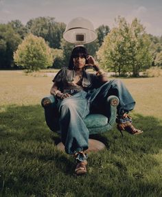 a man sitting in a chair with a frisbee on his head