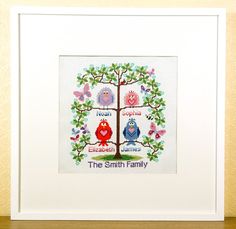 a cross stitch family tree with two owls and the words'the smith family '