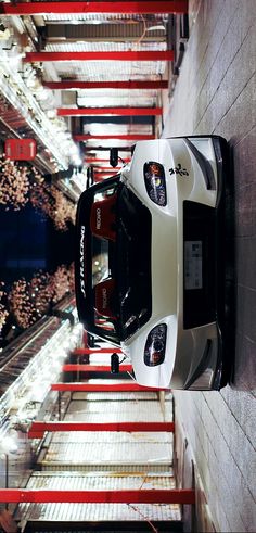 an aerial view of a car parked on the side of a building