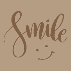 the word smile written in cursive writing on a brown background