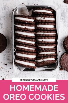 homemade oreo cookies with white icing in a tin