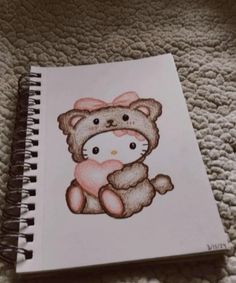 a drawing of a teddy bear with a pink bow on it's head sitting on a bed