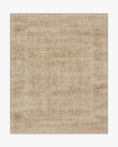 a beige rug with an intricate design on it