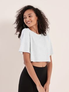 Essential Spring Staple.  Simple, light, and designed with a modern fit.   Unlike regular T-shirts, our Halfie tee is made with a proprietary fabric designed to be smooth like a dolphin.  Best styled with a nice pair of high-waisted pants or skirt.  Made with SUPESU Simply Soft Fibres.  Available in 2 essential styles. Shop OVERSIZED Brazilian model is 5'10, 34B, wearing size S. Caucasian model is 5'8, 34B, wearing size S.  All Simply Soft* styles are lifetime guarantee for pilling. If you exper Fitted Casual Cropped T-shirt With Scoop Neck, Casual Fitted Cropped T-shirt With Scoop Neck, Trendy Fitted Cropped T-shirt For Loungewear, Gray Stretch T-shirt For Loungewear, Summer Athleisure Cropped Crew Neck Shirt, Trendy Stretch T-shirt, Cropped Short Sleeve T-shirt For Summer Loungewear, Basic Stretch Cropped T-shirt For Loungewear, Casual Fitted Cropped T-shirt For Loungewear