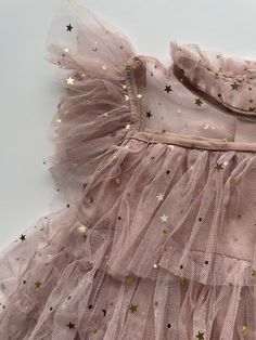 A beautifully designed layered Tulle party dress in Pink. You will find stars scattered across this dress to help your little one sparkle Festive Pink Ruffled Tutu Dress, Summer Festive Tutu Dress With Ruffles, Festive Ruffled Tulle Tutu Dress, Festive Tulle Tutu Dress With Ruffles, Sleeveless Star Print Party Dress, Star Princess Dress, Star Princess, Tulle Tutu Dress, Pink Tulle Dress