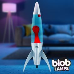 a blue and red rocket ship sitting on top of a carpet