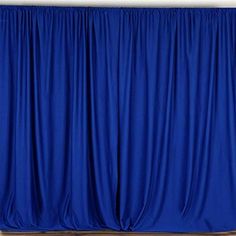 a blue curtain is hanging on the wall