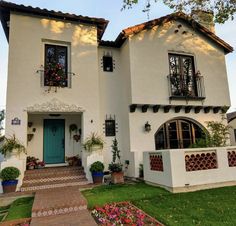 a white house with blue door and windows