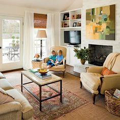 two children are sitting in chairs in the living room