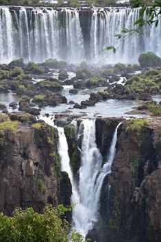 igua falls in the jungle with lots of water falling from it's sides