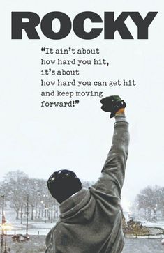 a skateboarder is holding his arms up in the air