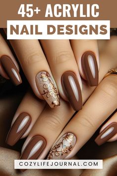 A variety of acrylic nail designs showcasing different patterns and embellishments on a hand with rich brown polish. Chocolate And Gold Nails, Black And Tan Nail Ideas, Brown Elegant Nails, Brown Matte Nails Design, Gorgeous Nails Designs Classy, Brown Gel Nails Designs, Brown Nail Designs Acrylic, Elegant Brown Nails, Brown And Nude Nails