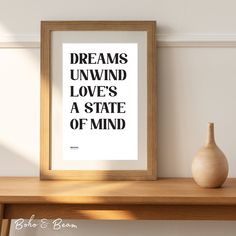 a framed poster with the words dreams unwind loves a state of mind