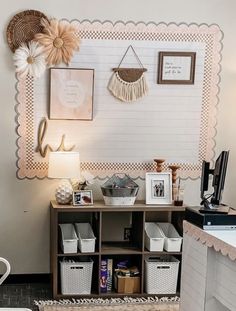 a room with some baskets and pictures on the wall