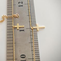 "14K Gold Double Layered Cross Necklace, Double Strand Tiny Cross Necklace, Cross Layering Necklace Gift For Christmas. Makes a perfect gift for bridesmaids, mom, wife, girlfriend, fiance or anybody else that is special to you. Comes in a cute gift box ready for gifting. This beautiful sideways cross Bracelet was made popular by Jennifer Lopez, Kelly Ripa, Selena Gomez, and many other celebrities. Make it your own and add it to any outfit to add elegance and interest. The perfect versatile piece Layered Cross Necklace, Tiny Cross Necklace, Custom Bar Necklace, Layered Crosses, Sideways Initial Necklace, Tiny Cross, Gold Letter Necklace, Floating Necklace, Kelly Ripa