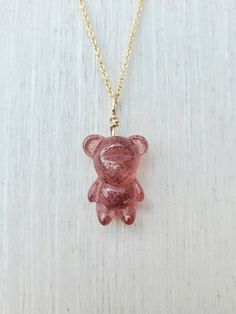 This Strawberry Quartz bear necklace features a piece of carved bear- shape natural Strawberry Quartz sized about 17mm tall and 12mm wide.  It is wire wrapped in solid sterling silver or 14k gold-filled with your choice.  This cute bear pendant comes with your choice of chain material and length. The silver chain is 1.3mm solid sterling silver and the gold-filled chain is 1.5mm wide 14k yellow gold filled.  This dainty bear necklace is a perfect gift for yourself or your loved ones, especially f Bear Design Pendant Jewelry For Gifts, Bear Design Pendant Jewelry As Gift, Bear Design Pendant Jewelry Gift, Gummy Bear Necklace, Bear Shape, Chakra Racine, Seahorse Pendant, Necklace Cute, June Birthstone Jewelry