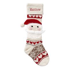 a christmas stocking with a santa clause on it's side and hearts around the bottom