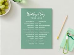 a green wedding program sitting on top of a table