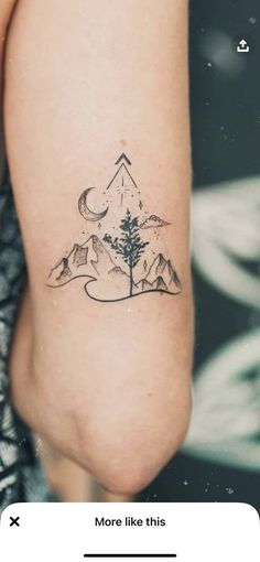 a woman's arm with a small tree and mountains tattoo on the left side