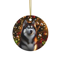 a christmas ornament with a husky dog in front of a decorated christmas tree