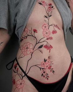 a woman's stomach with flowers on it