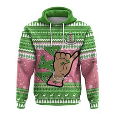 a green and pink christmas sweater with an image of a hand holding the peace sign