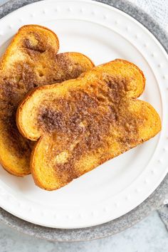 two pieces of french toast on a white plate