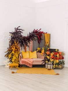 a living room filled with lots of furniture and flowers