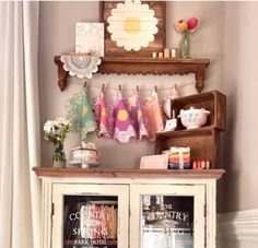 an old cabinet is decorated with colorful items