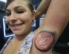 a woman with a tattoo on her arm